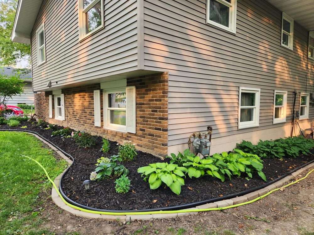 Our Mulch Installation service provides a cost-effective and aesthetically pleasing solution to prevent weed growth, retain moisture in the soil, and enhance the overall appearance of your landscape beds. for K & I Lawn Care Service  in Eden Prarie, MN