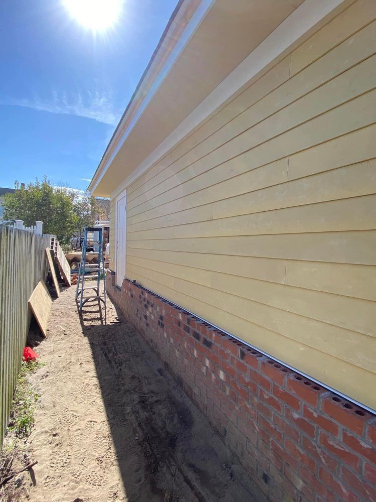 Our cement lap siding service provides durable and attractive siding options for your home, ensuring protection against harsh weather conditions while enhancing its aesthetics. for Safe Roofing Inc in Jacksonville, NC