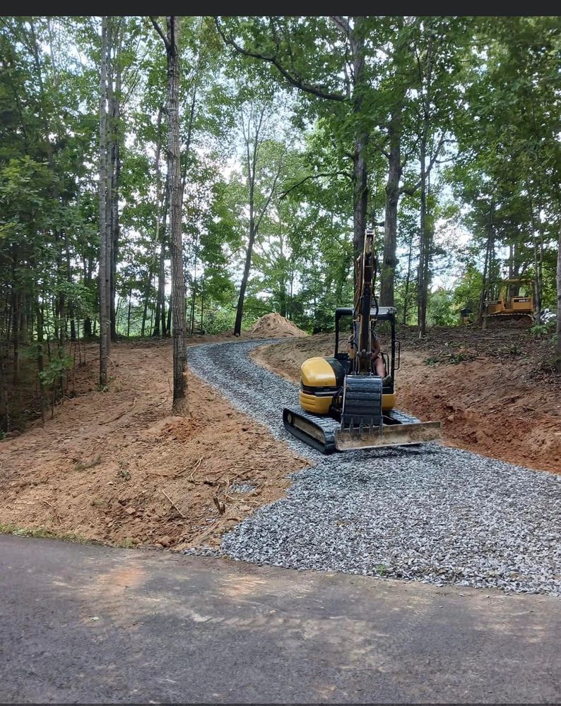 Our Roadbeds service ensures durable and stable foundations for driveways, pathways, or private roads by expertly preparing and leveling the ground, providing a reliable surface tailored to your property's specific landscape needs. for Double V Services in Dickson, TN