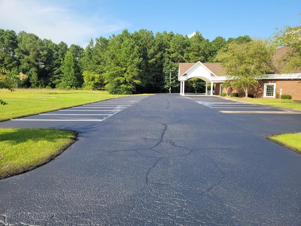 Our Parking Lot Stripping service includes freshly painting lines and markers in your driveway or parking lot to clearly designate spaces, ensuring organized and efficient use of the space. for Southeast Sealing & Striping in Bladenboro, NC