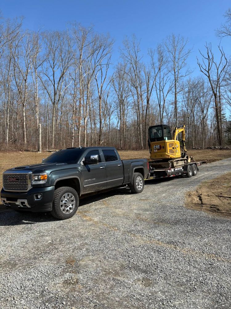 Our Tilt Deck Car Hauler service offers a convenient and effortless solution for transporting vehicles, featuring an easy-to-use tilt system that simplifies loading and ensures secure hauling every time. for Chapman Rentals in Ellington, CT