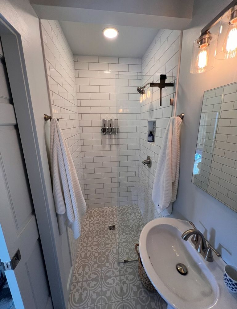 Enhance your bathroom with our expert tiling service, offering precision installation and a diverse selection of high-quality tiles, ensuring durability and a stunning finish for your remodeling project. for Cote Builders in Tryon, NC