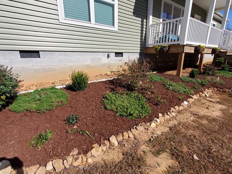 Enhance your garden's health and appearance with our professional mulch installation service, providing nutrient-rich coverage that retains moisture, suppresses weeds, and promotes thriving plant growth for a beautiful landscape. for Fields Lawn Care in Appomattox, VA