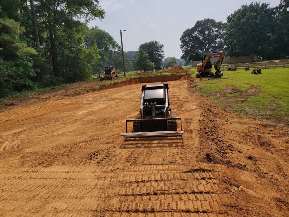 Our Property Grading service enhances your landscape by leveling the ground for optimal soil drainage and erosion prevention. Pair with our expert cleaning services to maintain a pristine outdoor space. for RA Lawn Care, Landscape & Hardscape in Littleton, NC