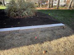 Our expert retaining wall construction service enhances your landscape's functionality and aesthetics, providing durable solutions for soil erosion control while seamlessly integrating with your outdoor design to increase property value. for New England Outdoor Living in Salisbury, MA