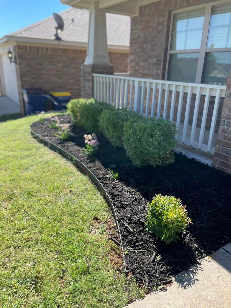 Enhance the beauty and health of your landscape with our professional mulch installation service. Our experienced team will add a layer of organic mulch to retain moisture, suppress weeds, and improve soil structure. for Divine Landscaping Services  in Stillwater, OK