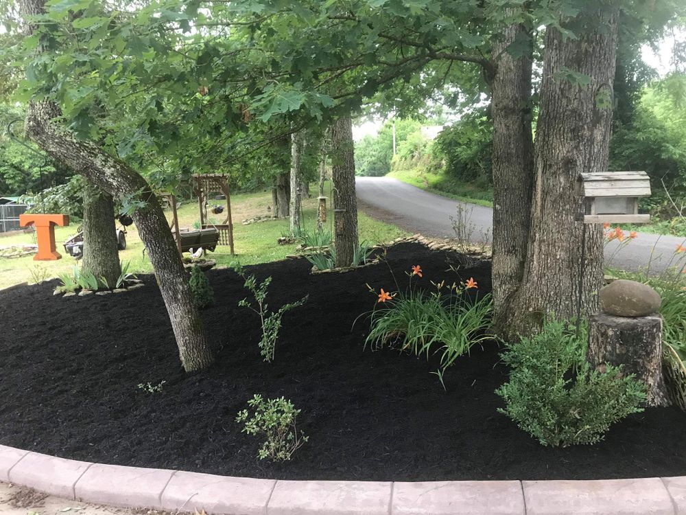 Our Mulch Installation service enhances your landscaping by adding a layer of mulch that improves soil quality, retains moisture, suppresses weeds, and gives a polished look to your outdoor space. for Infusion Lawn & Landscapes in Knoxville, Tennessee