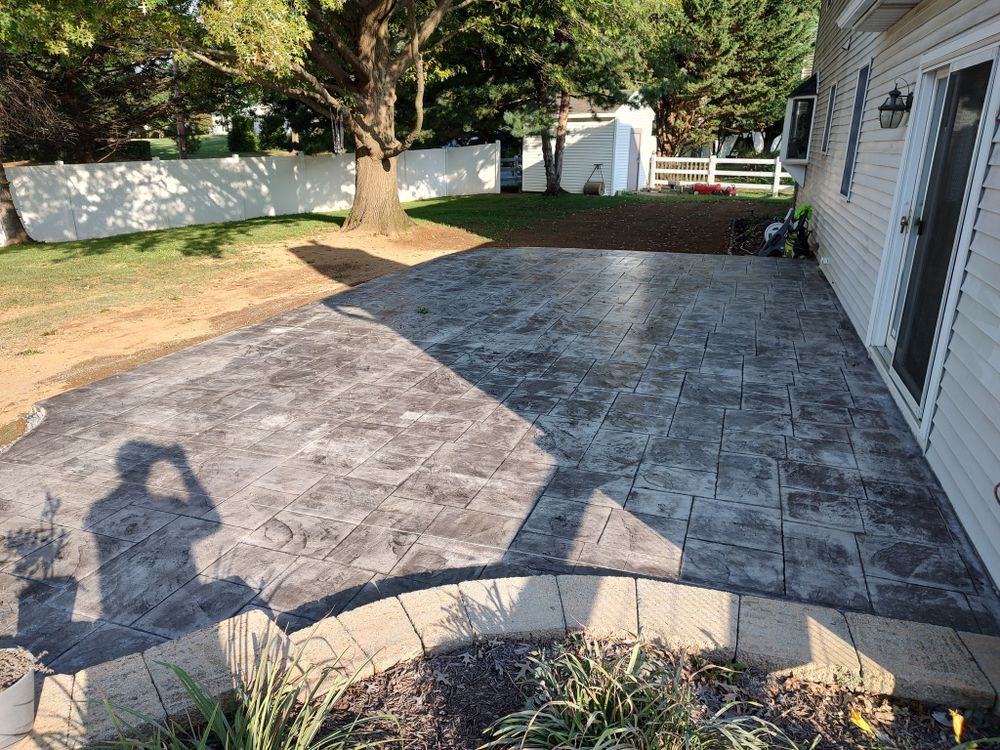 Our Stamped Concrete Installation service transforms your outdoor space with beautiful, durable patterns and textures that mimic high-end materials, providing an affordable and stylish solution to enhance your home's curb appeal. for Cann's Concrete and Construction in Coopersburg, PA