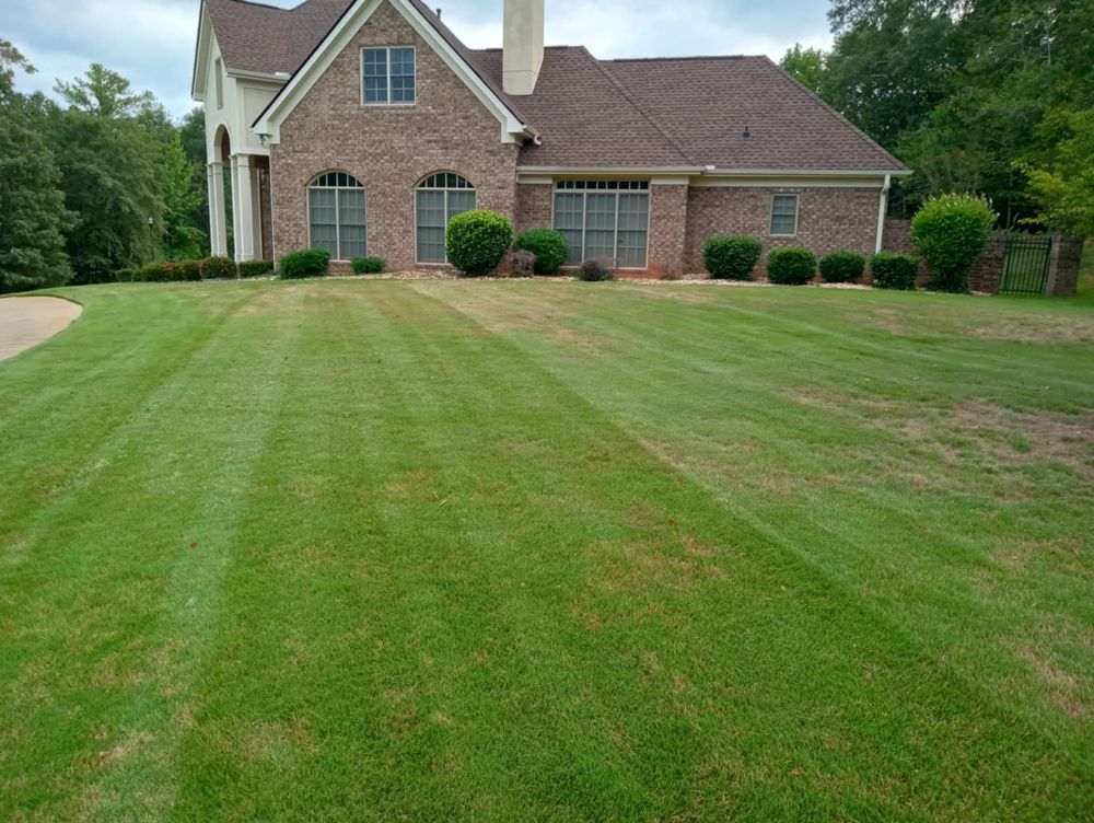 Enhance your home's curb appeal with our professional mowing services, ensuring a pristine lawn. Our team provides reliable and efficient care, delivering lush results that make your landscape stand out effortlessly. for Herring Lawn Care in Columbus, GA