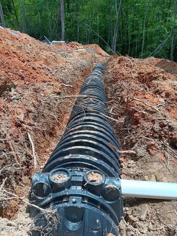 Our Dirt Work service ensures precise land grading, excavation, and site preparation for optimal septic system installation or repair, enhancing your property's functionality and preventing future drainage issues. for Forrest Plumbing and Septic Service LLC in Summerville, GA