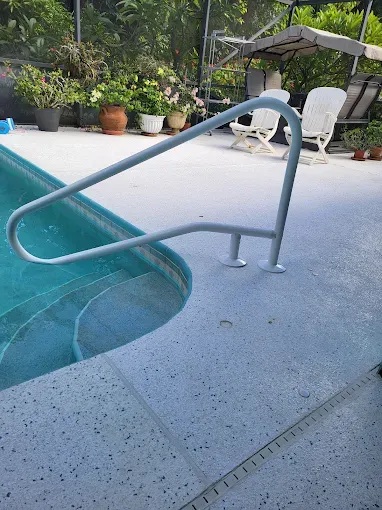 Enhance pool safety and style with our custom handrails. Expertly designed and installed, we offer reliable support while complementing your pool's aesthetic for a seamless and secure backyard experience. for MCN Pool Fence in Port St. Lucie, FL