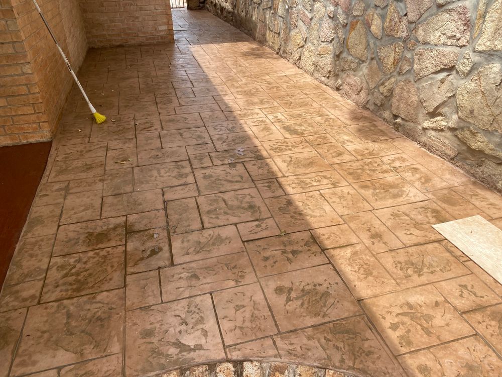 Enhance your outdoor living space with our professional stamped concrete installation services, perfect for deck & patio installations that combine durability and style to create a stunning, functional area for entertaining. for Delatorre Construction in El Paso, TX
