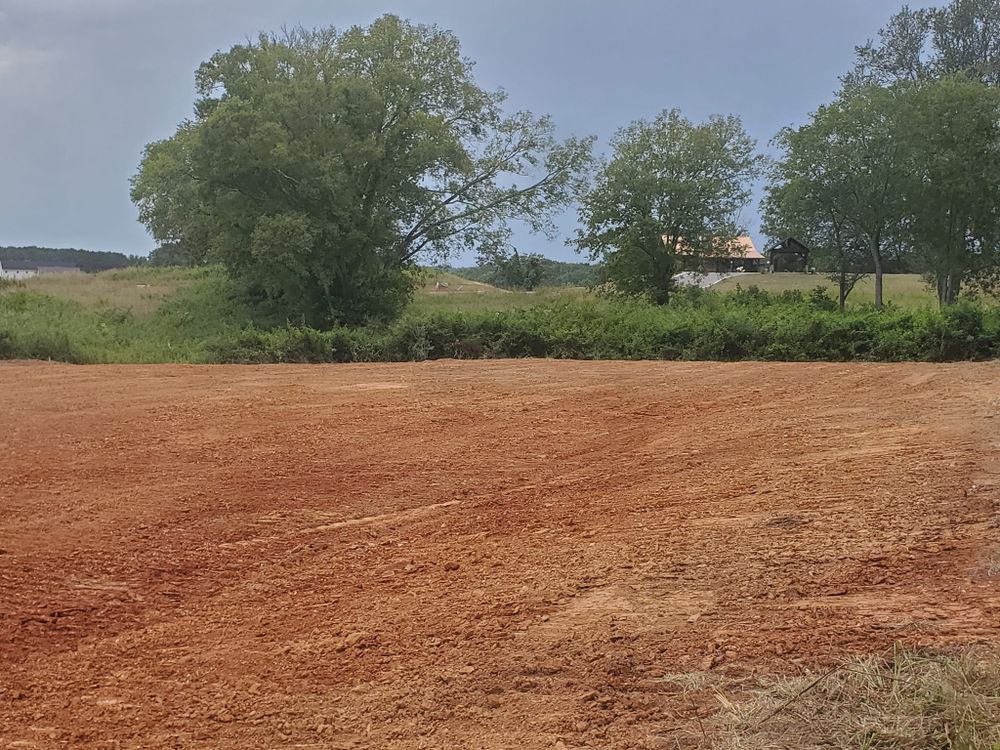 Our Leveling service ensures a stable, even foundation for your projects by expertly distributing soil and removing uneven terrain, enhancing safety and durability for construction or landscaping endeavors on your property. for H&H Earthworks in Decherd, TN