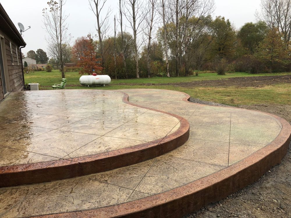 Transform your outdoor space with our expert stamped concrete installation service, offering durable and visually stunning surfaces that mimic the beauty of natural materials while enhancing your home's aesthetic appeal. for Concrete Pros, LLC in Lorain, OH