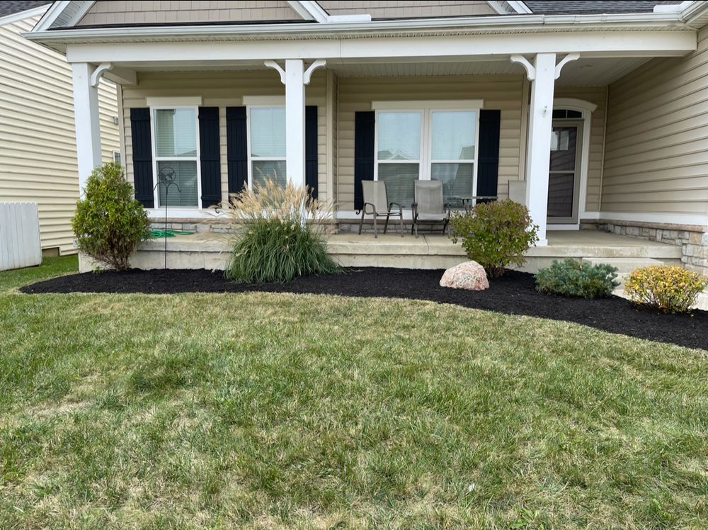 Our Mulch Installation service helps improve the aesthetic appeal of your landscaping while also retaining soil moisture, suppressing weeds, and protecting plant roots during extreme weather conditions. for Clean Green Lawns LLC in Dayton, OH