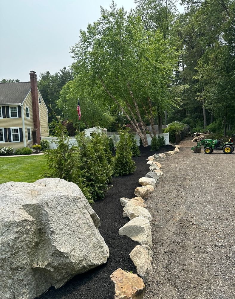 Enhance your garden's health and appearance with our professional mulch installation service, designed to retain moisture, reduce weeds, and enrich soil for a flourishing landscape all year round. for Pote Landscaping LLC in Wilmington, MA