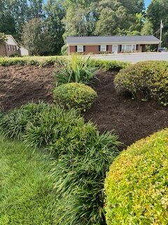 Our Mulch Installation service enhances your landscaping by adding a layer of mulch that improves soil quality, retains moisture, suppresses weeds, and gives a polished look to your outdoor space. for Dream Cuts Landscaping and Lawn Care LLC in Gastonia, NC