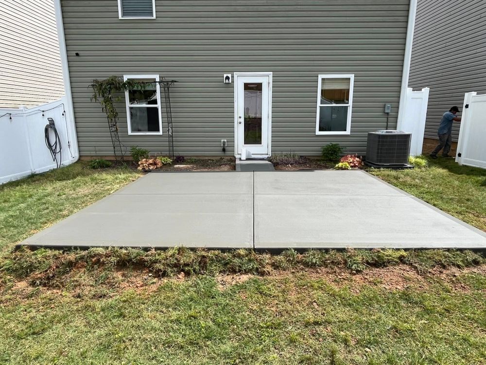 Enhance your outdoor living space with our expert patio design and installation services, offering durable concrete solutions tailored to your style for a perfect blend of beauty and functionality in your home. for Wicks Construction Group in Duncan, SC