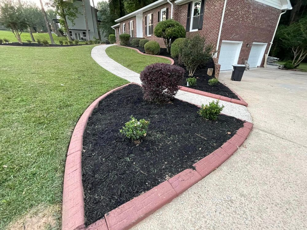 Our Mulch Installation service offers a cost-effective and aesthetic solution to enhance your garden beds. Our team will expertly install mulch to improve soil health, retain moisture, and reduce weed growth. for Worsham Landscaping and Pressure Washing LLC in Social Circle, GA