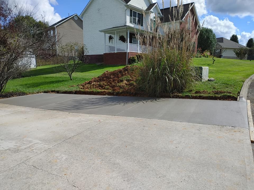 Our Driveway Installation service, complemented by professional sidewalk installation services, ensures a durable and aesthetically pleasing entrance to your home that enhances curb appeal and withstands daily wear. for Gunter's Concrete in Newport, TN