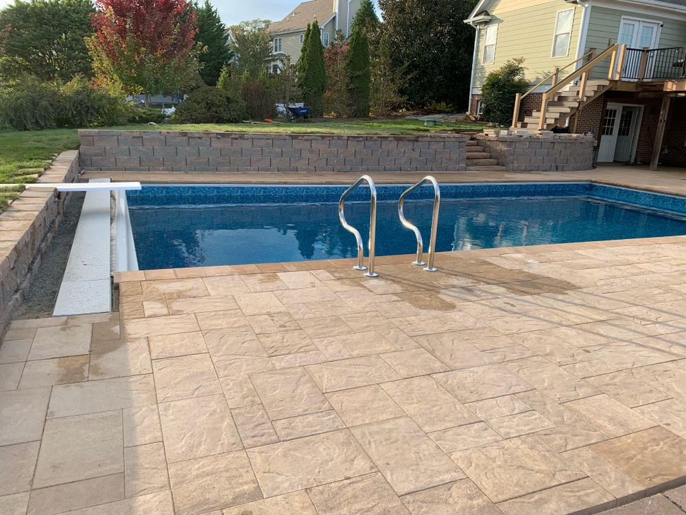 Enhance your outdoor space with our Custom Pool Construction service, seamlessly integrating patio design & construction to create a stunning, functional backyard oasis tailored specifically to your needs and aesthetic preferences. for Horizon Construction in Covington, VA