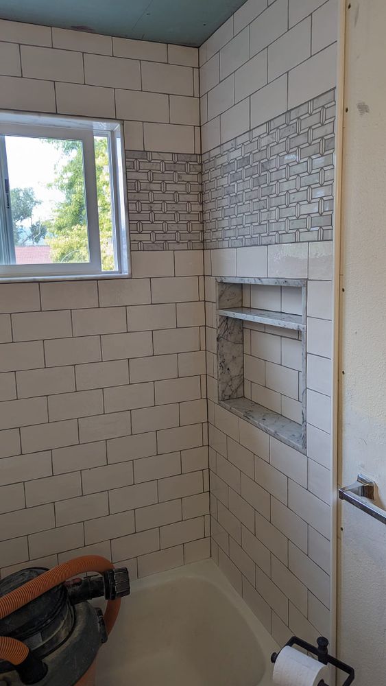 Transform your bathroom with our expert tiling service, offering precision installation and a wide selection of high-quality tiles to enhance both beauty and functionality in your space. for Rick's Tile and Marble in Taylorsville, UT