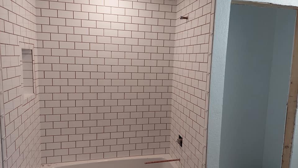 Transform your bathroom with our professional Shower Tile service. Choose from a variety of stylish and durable tiles to create a stunning and functional shower that enhances the overall aesthetic of your home. for Henning Floor Covering in Lawton, OK