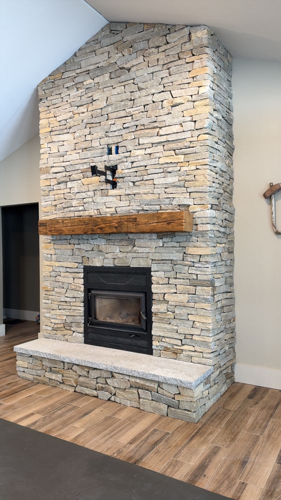 Our Retaining Wall Construction service expertly designs and builds durable, aesthetically pleasing retaining walls to enhance your landscape’s functionality and beauty while preventing soil erosion on your property. for Smythe’s Stonework & Masonry in Buxton, ME