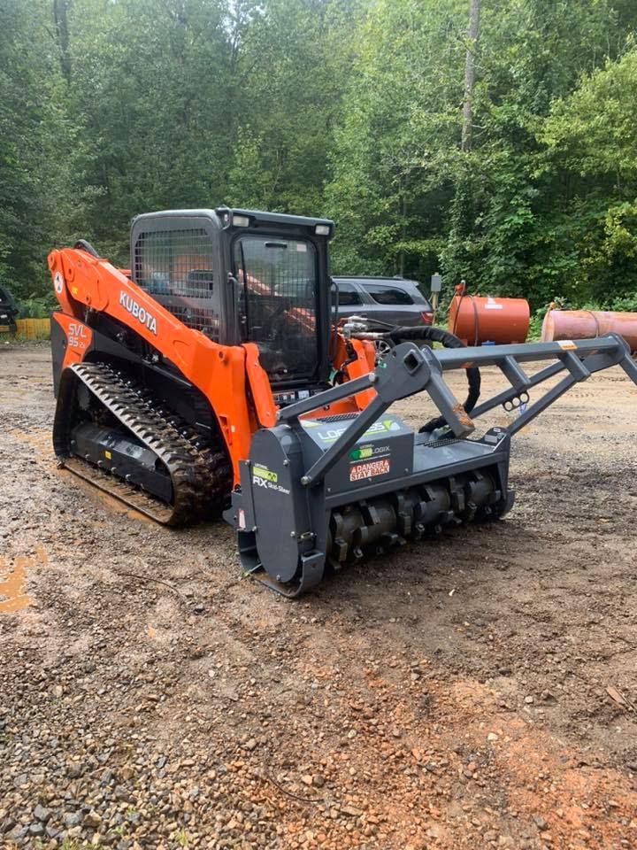 Our Forestry Mulching service efficiently clears overgrown land, transforming dense vegetation into nutrient-rich mulch. It's an eco-friendly solution that enhances property aesthetics and prepares the land for future projects. for Grading & Clearing Services in Dawsonville, GA