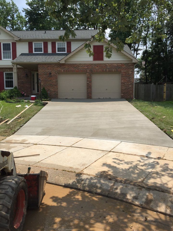Enhance your home's curb appeal with our expert driveway concrete installation service, providing durable, visually stunning driveways that replicate the look of stone or brick at an affordable cost. for Dixie Concrete Masonry LLC in Saint Leonard, MD