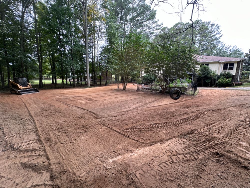 Expert skid steer grading services in Fayetteville, GA! At Dirt Pro Land Solutions, we specialize in land leveling, driveway grading, and site preparation with precision and efficiency. We provide reliable and professional results, tailored to you. for Dirt Pro Land Solutions in Fayetteville, GA