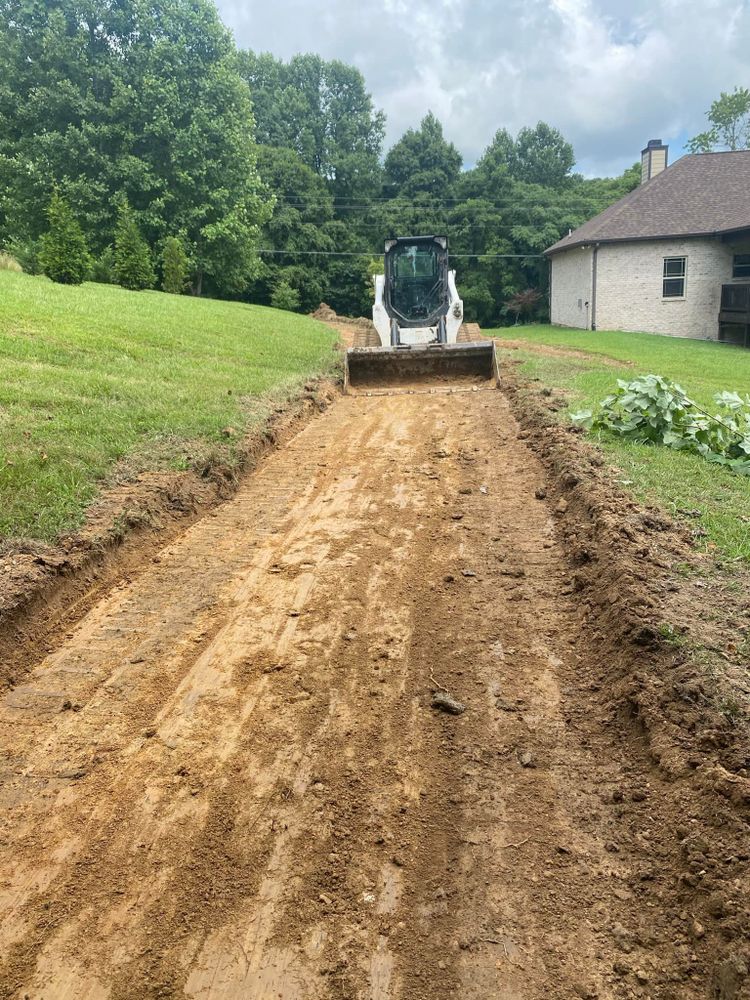 Our Land Grading service ensures a smooth, even surface by expertly removing tree stumps and leveling your outdoor space, preparing it for beautiful landscaping or hardscaping projects that elevate your home's curb appeal. for Real Deal Lawn Care in Goodlettsville, TN