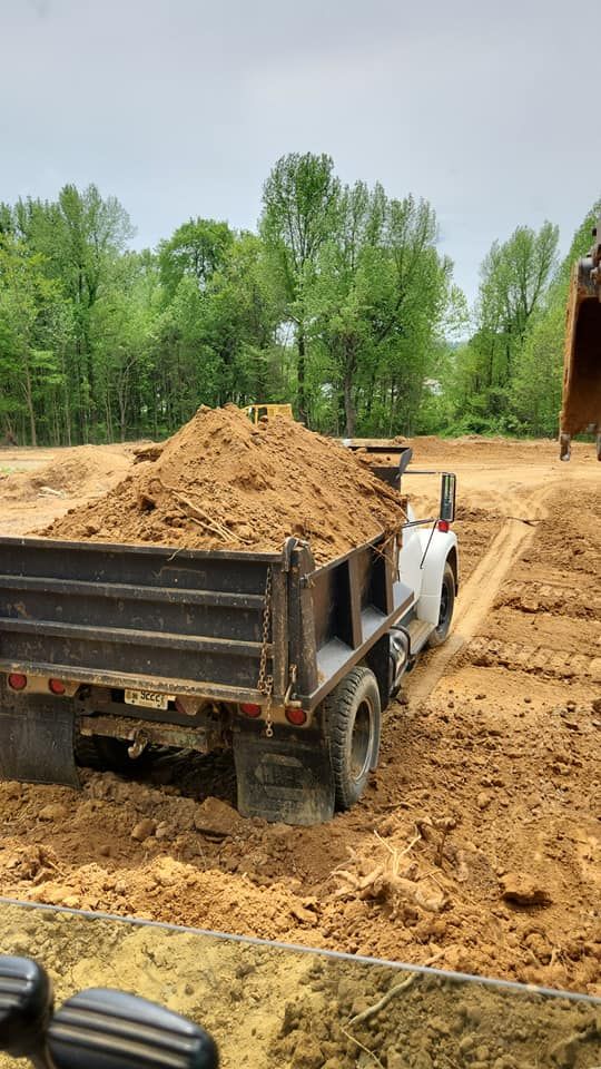 Our Debris Removal service efficiently clears construction waste, yard debris, and unwanted materials, ensuring a clean site. We prioritize safety and eco-friendly disposal to keep your property looking pristine. for Watkins Excavation in Robards, KY