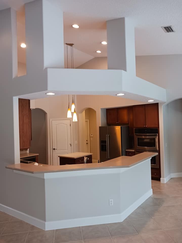 Revitalize your kitchen with our expert refinishing service. We transform your cabinets, giving them a fresh, modern look and extending their lifespan without the need for costly replacements. for Bradley Bradshaw Painting in Christmas, FL