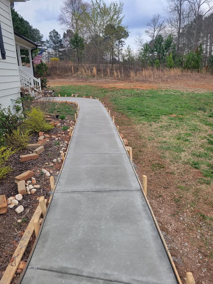 Our concrete services specialize in crafting durable and aesthetically pleasing sidewalks, ensuring safety and curb appeal for your home with professional installation that stands the test of time. for Good Hope Concrete in Monroe, GA