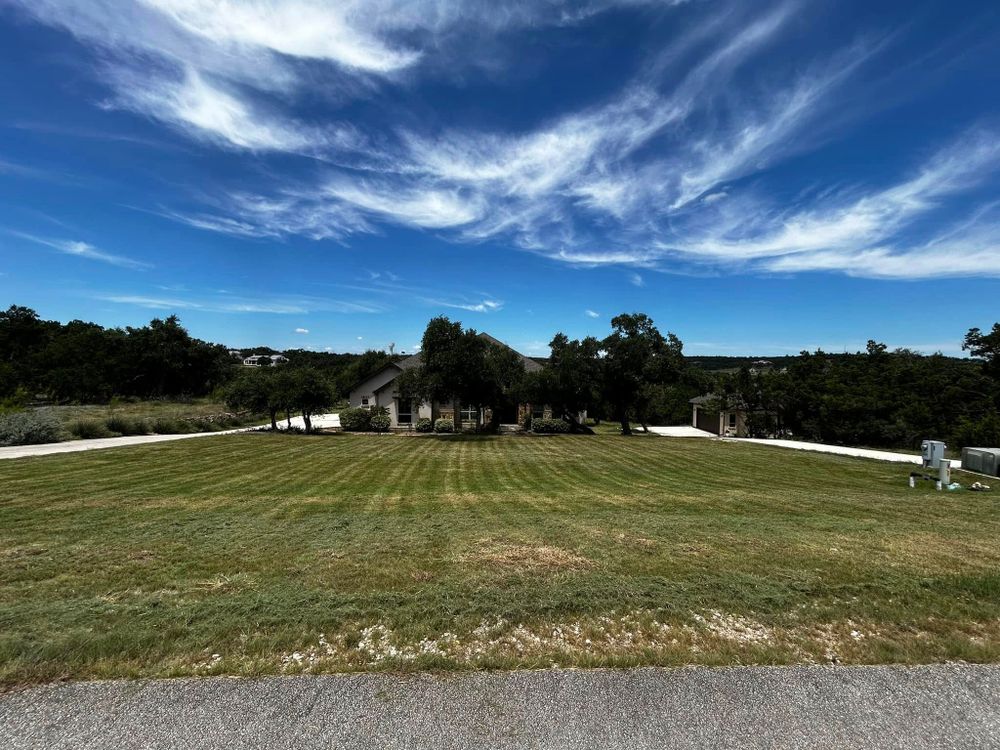 Our lawn care maintenance service ensures your yard stays healthy and vibrant, offering regular mowing, edging, fertilization, and weed control to keep your landscape looking pristine all year round. for Good and Green Landscaping in Canyon Lake, TX