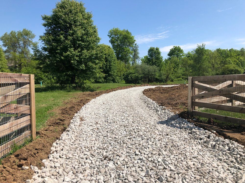 Our Gravel Driveway service offers professional grading and compacting of gravel surfaces to create a durable, low-maintenance driveway that enhances the curb appeal and functionality of your home. for Collins Constructors in Fyffe, AL