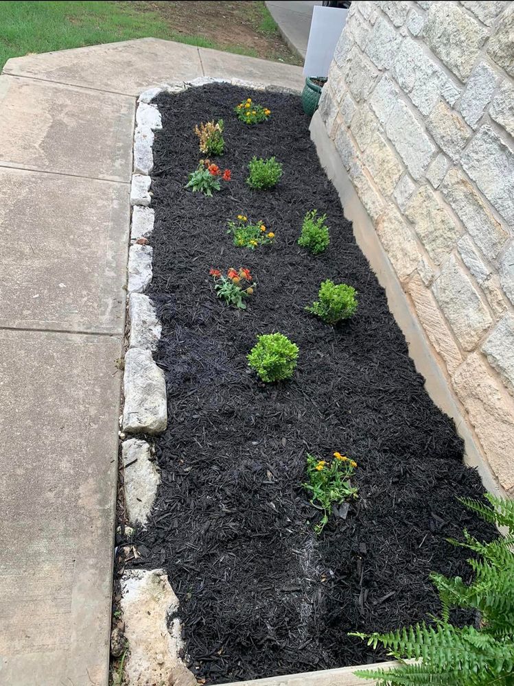 Our Mulch Installation service offers a low-maintenance solution to enhance the aesthetic appeal of your landscaping while also helping to retain moisture, reduce weeds, and protect plant roots. for Rustic Roots Landscaping in Austin, TX