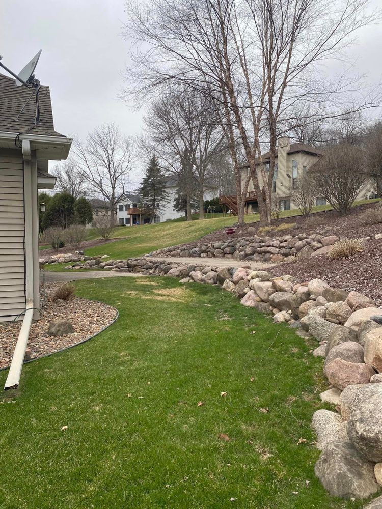 Our Natural Stone Hardscape service offers homeowners durable and beautiful outdoor living spaces using high-quality natural stones for pathways, patios, and retaining walls to enhance the overall landscape design. for J&F Lawn and Yard Care  in Burnt Hills, NY