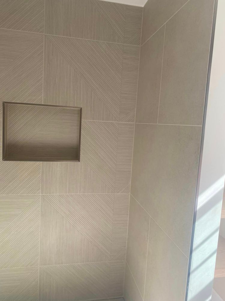 Our Custom Tile Showers service offers homeowners the opportunity to design and install a personalized shower space with high-quality tile options, creating a luxurious and customized bathroom experience. for D&M Tile  in Denver, CO