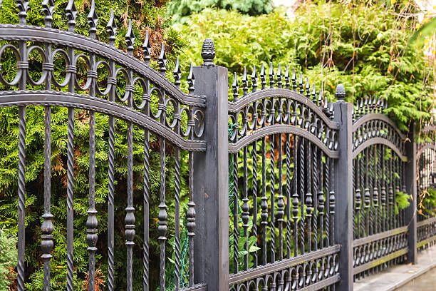 Our wrought iron fences combine elegant curb appeal, lasting durability, and dependable security, expertly installed to enhance your home's exterior while defining boundaries with timeless style and low-maintenance performance. for Walker Custom Exteriors in Dallas, TX