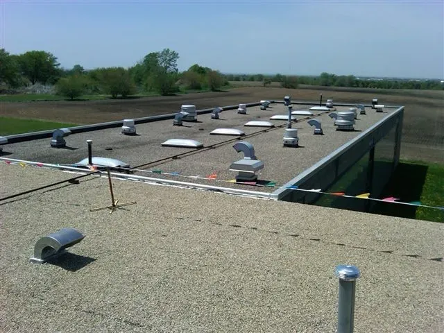 Our Built Up Roofing service includes multiple layers of materials to protect your building from water damage, ensuring long-lasting protection and durability for all your roofing repair needs. for Elmcrest Construction in Harris,  MN