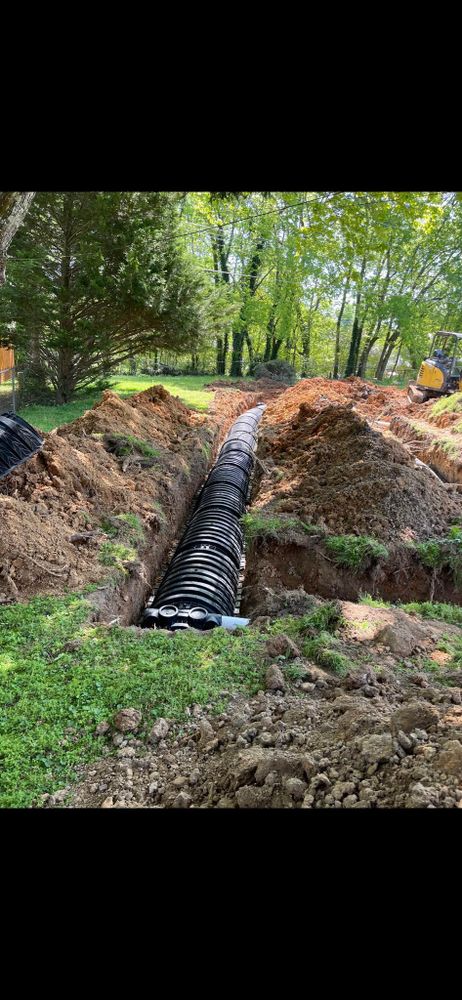 Our Drainage System Install & Repair service ensures efficient water flow and prevents property damage by expertly installing, maintaining, and repairing drainage systems tailored to your home's specific landscape needs. for Walker Septic & Drain LLC in Chickamauga, GA