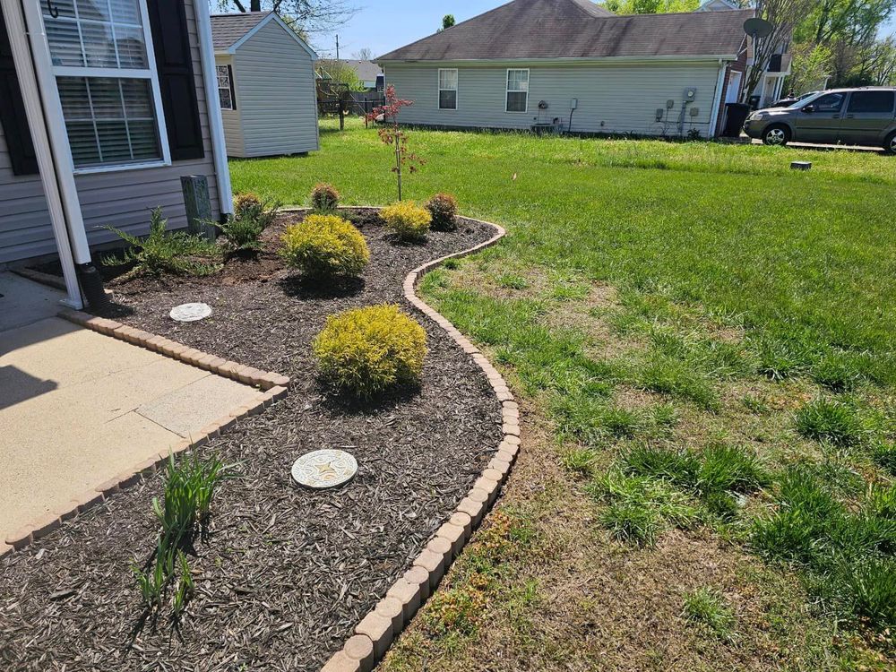 Our Mulch Installation service helps improve the aesthetic appeal of your landscaping while also retaining soil moisture, suppressing weeds, and protecting plant roots during extreme weather conditions. for Tactical Lawn Maintenance in  Murfreesboro ,  TN