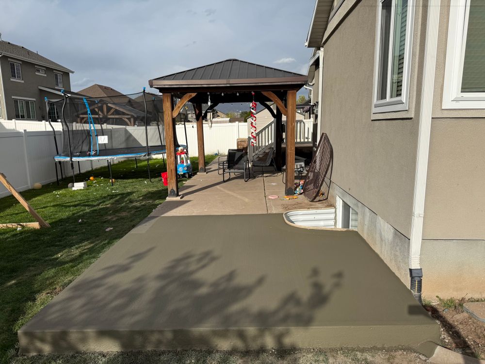 Transform your outdoor space with our expert Patio Design & Installation service, offering customized concrete solutions that blend style and functionality to create the perfect oasis for relaxation and entertainment. for TNT Concrete and Construction LLC in Roy, UT