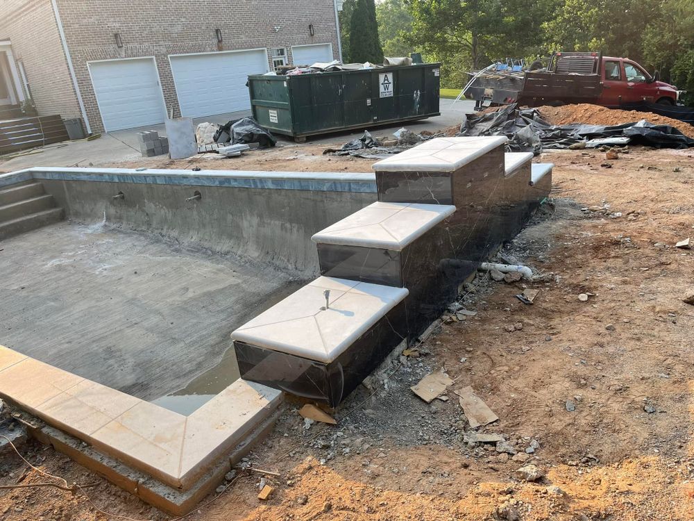 Enhance your outdoor space with our expert retaining wall installation, providing stability and elegance to your pool area while preventing soil erosion and ensuring a safe, attractive landscape for years to come. for Primetime Pools LLC in Winder, GA