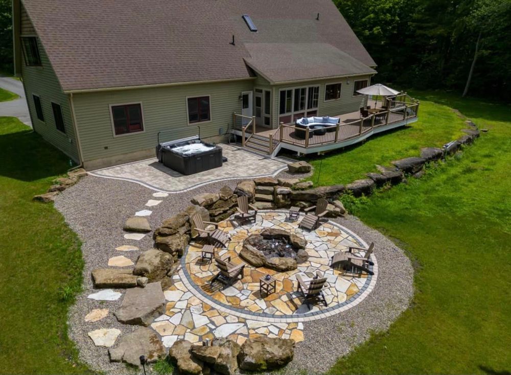 Our Patio Design & Construction service offers homeowners expert masonry work to create beautiful and functional outdoor living spaces, enhancing the aesthetic appeal and value of their property. for Freelance Contracting in Saratoga Springs, NY