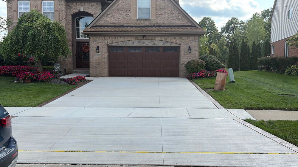 Crown Cement installs and replaces concrete driveways across Canton, Plymouth, Livonia, Novi, Wyandotte and Southeast Michigan. We handle Tear out, base prep forming, reinforcement, pouring, finishing, saw cuts and cleanup. for Crown Cement in Canton Township, MI