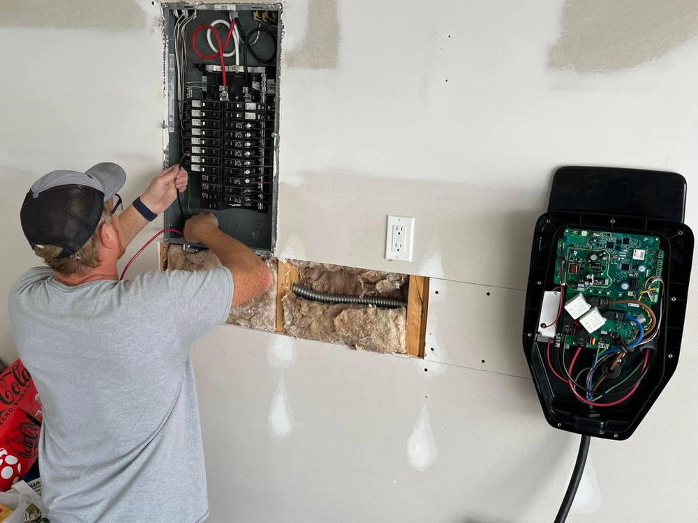 Our EV Charger Install service ensures a seamless home integration, providing fast and reliable charging capabilities for your electric vehicle, enhancing convenience and adding value to your property's infrastructure. for Holland Builders in Jacksonville, NC