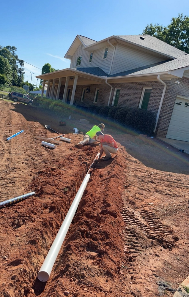 Our Drainage Solutions service helps homeowners effectively manage water runoff, preventing potential damage to their property and creating a healthier outdoor environment. for Peach State Landscaping in Hartwell, GA